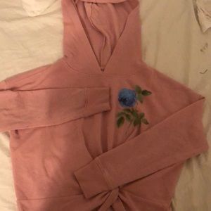 A light pink hoodie with a flower!